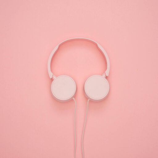 Aesthetic pink headphones on a pastel background, perfect for a modern and stylish look.